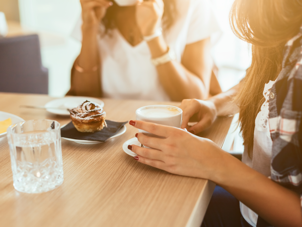 Women sharing coffee and breakfast