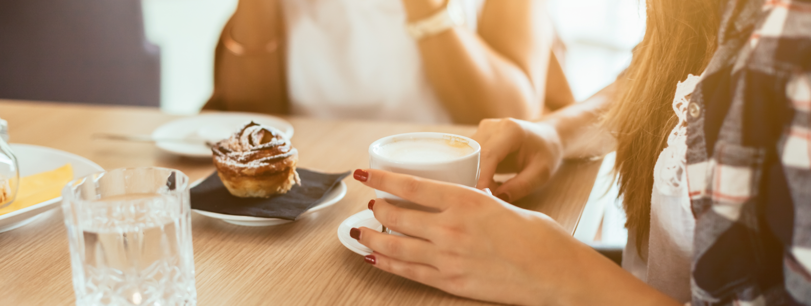 Women sharing coffee and breakfast