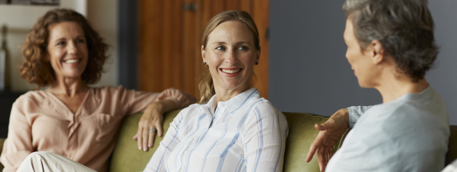 Women talking on a couch